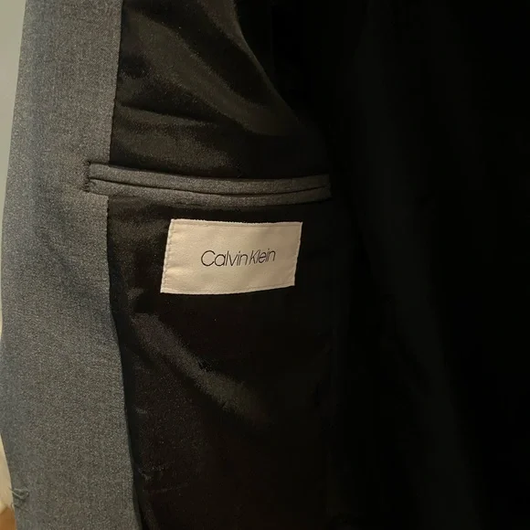 Boys slim stretch fit Calvin Kline gray suit. Size 12 pants/ 14 jacket